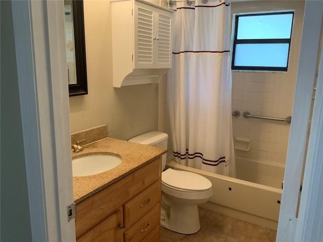 full bathroom with tile patterned floors, vanity, toilet, and shower / bath combo with shower curtain