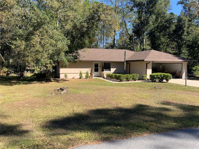 ranch-style house with a garage and a front lawn