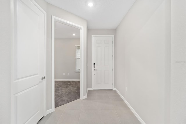 hallway with light tile patterned floors