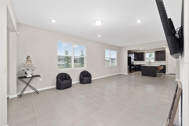 living area with light tile patterned floors