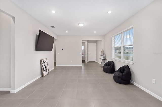 living area featuring light tile patterned floors