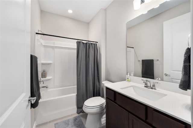 full bathroom featuring tile patterned floors, shower / bath combo, toilet, and vanity