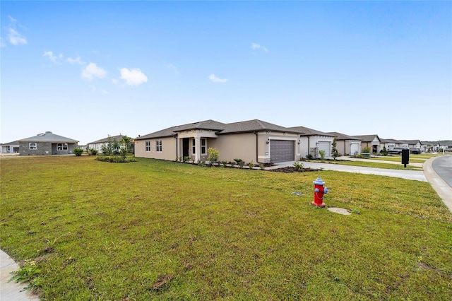 view of front facade featuring a garage and a front yard