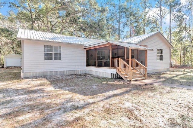 view of front of home featuring a sunroom