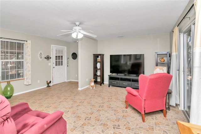 living room with ceiling fan