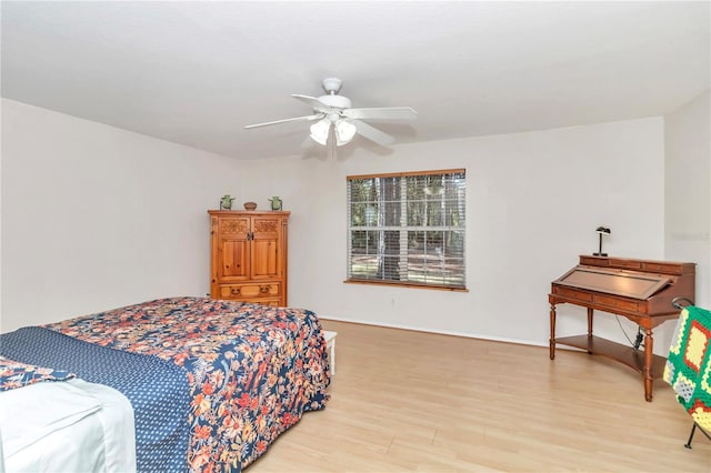 bedroom with ceiling fan and light hardwood / wood-style floors