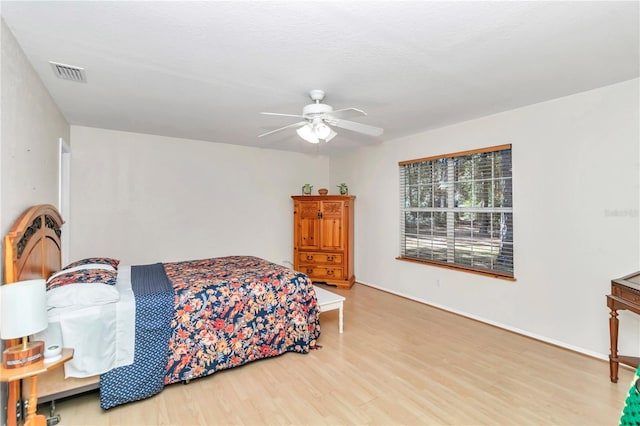 bedroom featuring ceiling fan and hardwood / wood-style flooring