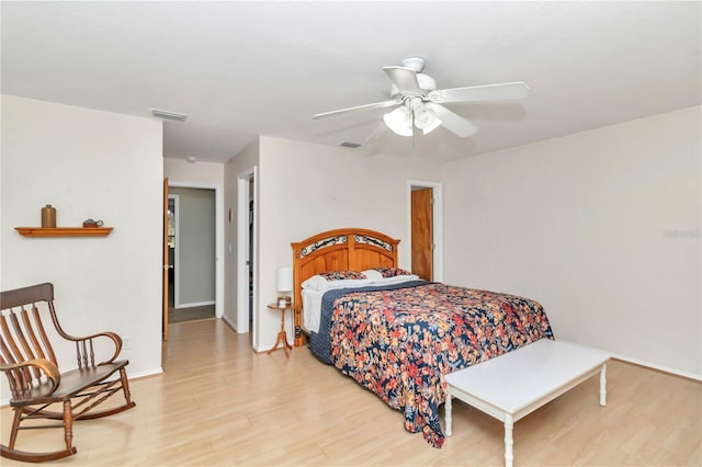 bedroom with ceiling fan and light hardwood / wood-style flooring