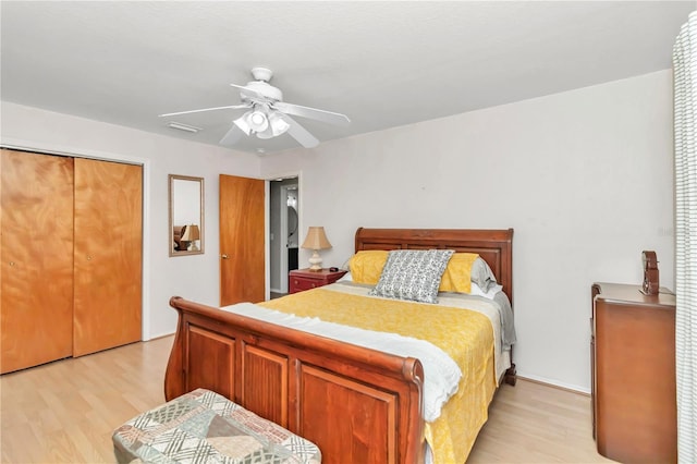 bedroom featuring light wood-type flooring, a closet, and ceiling fan