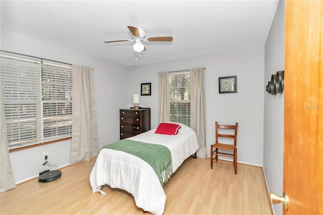 bedroom featuring hardwood / wood-style flooring and ceiling fan