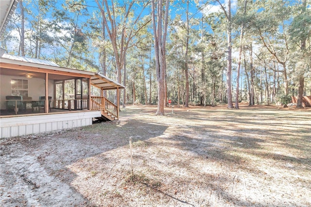 view of yard with a sunroom