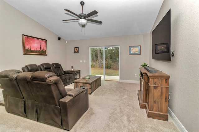 carpeted living room with vaulted ceiling and ceiling fan