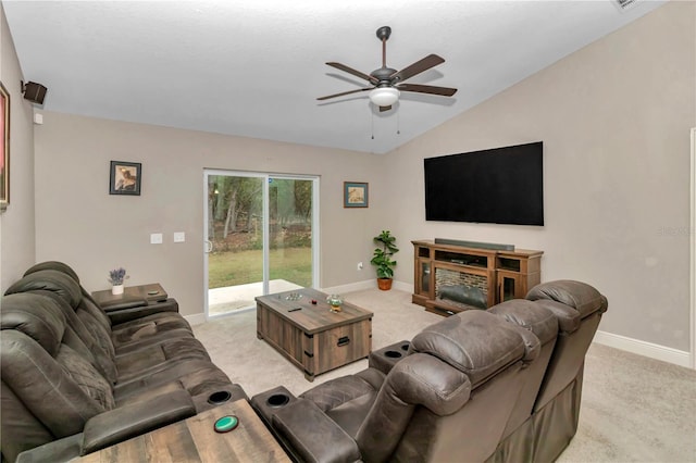 living room with ceiling fan, light carpet, and vaulted ceiling