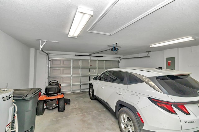 garage with a garage door opener and electric panel