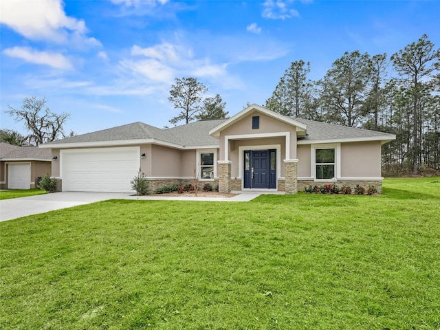 view of front of home with a front yard and a garage