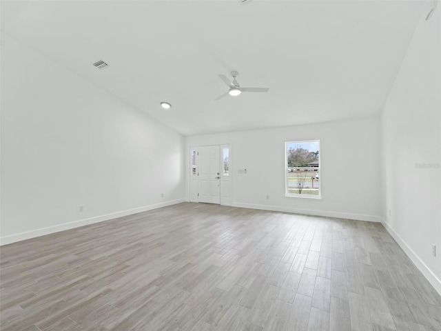 empty room with ceiling fan and light wood-type flooring