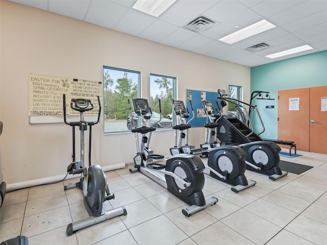 workout area featuring a paneled ceiling