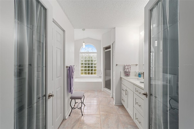 bathroom featuring a textured ceiling, vanity, lofted ceiling, and shower with separate bathtub