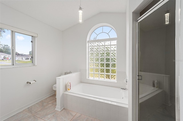 bathroom with shower with separate bathtub, vaulted ceiling, toilet, and tile patterned floors