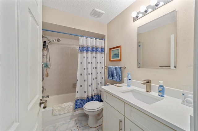 full bathroom featuring shower / bath combo, tile patterned flooring, a textured ceiling, toilet, and vanity