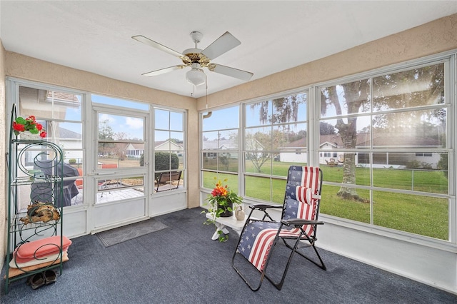 sunroom / solarium featuring ceiling fan and a healthy amount of sunlight