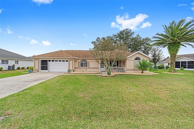 ranch-style home with covered porch, a garage, central AC, and a front lawn