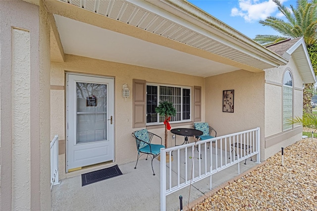 doorway to property featuring a porch