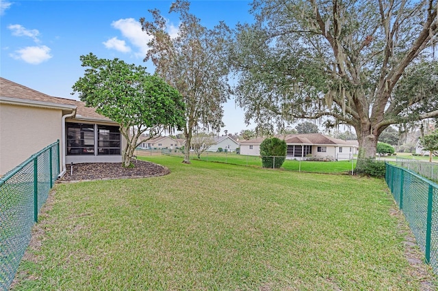 view of yard with a sunroom