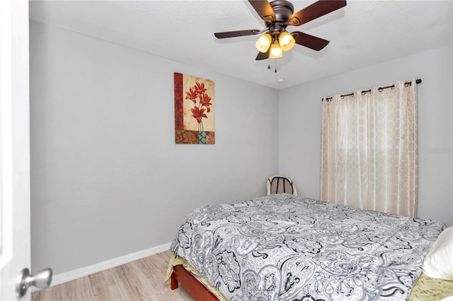 bedroom featuring ceiling fan and wood-type flooring