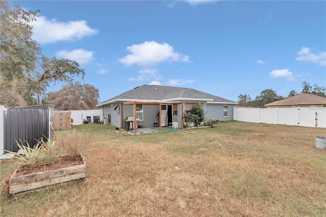 rear view of house with a lawn