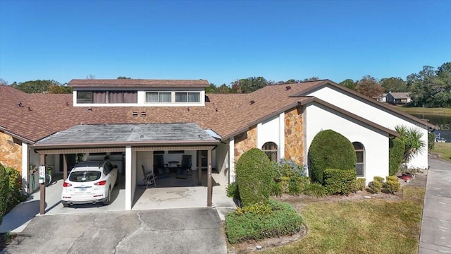 view of front of home featuring a carport