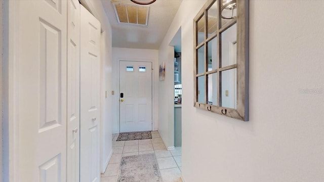 hallway with light tile patterned flooring