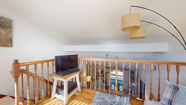 interior space with wood-type flooring and lofted ceiling