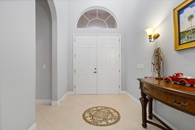 foyer entrance featuring light tile patterned floors