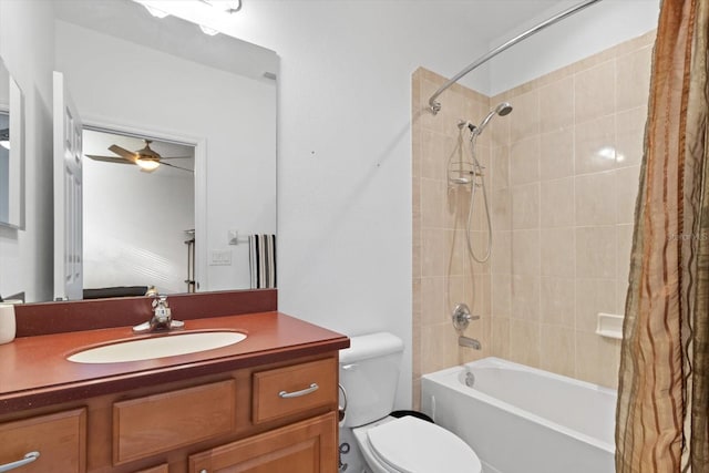 full bathroom featuring ceiling fan, toilet, vanity, and shower / tub combo