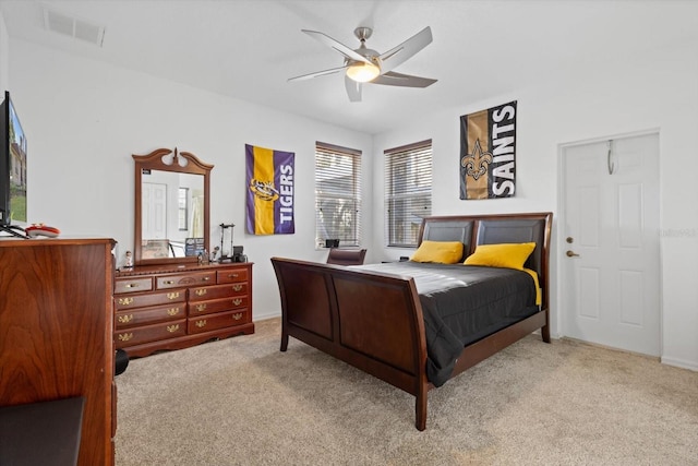 bedroom with light colored carpet and ceiling fan