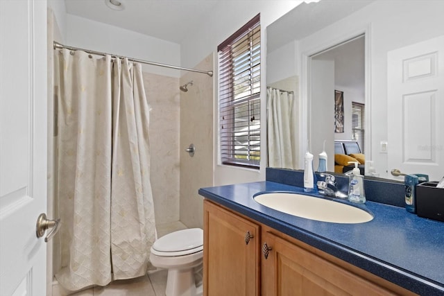 bathroom featuring tile patterned flooring, vanity, toilet, and a shower with curtain