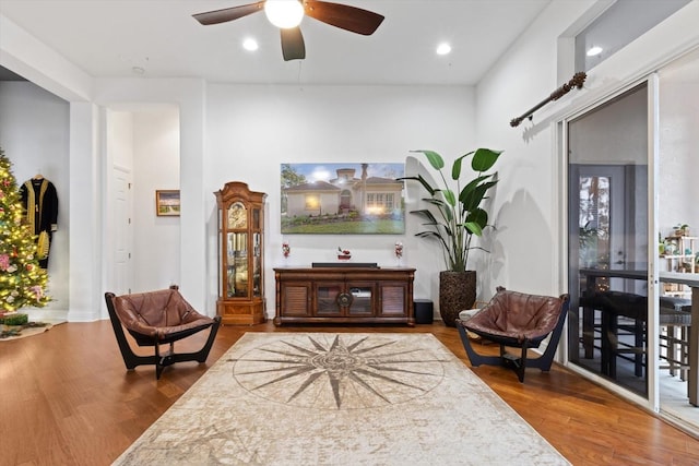 sitting room featuring hardwood / wood-style flooring and ceiling fan