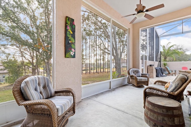 sunroom / solarium featuring ceiling fan