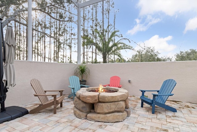 view of patio featuring a fire pit