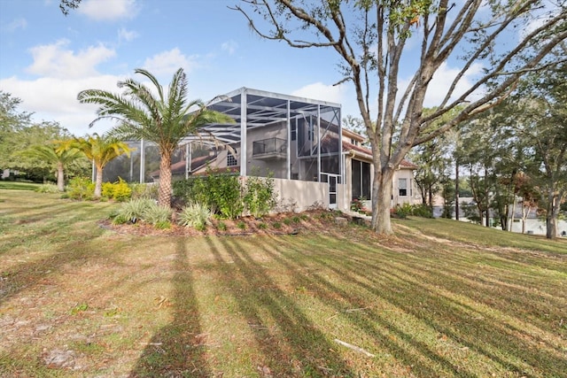 view of yard featuring glass enclosure