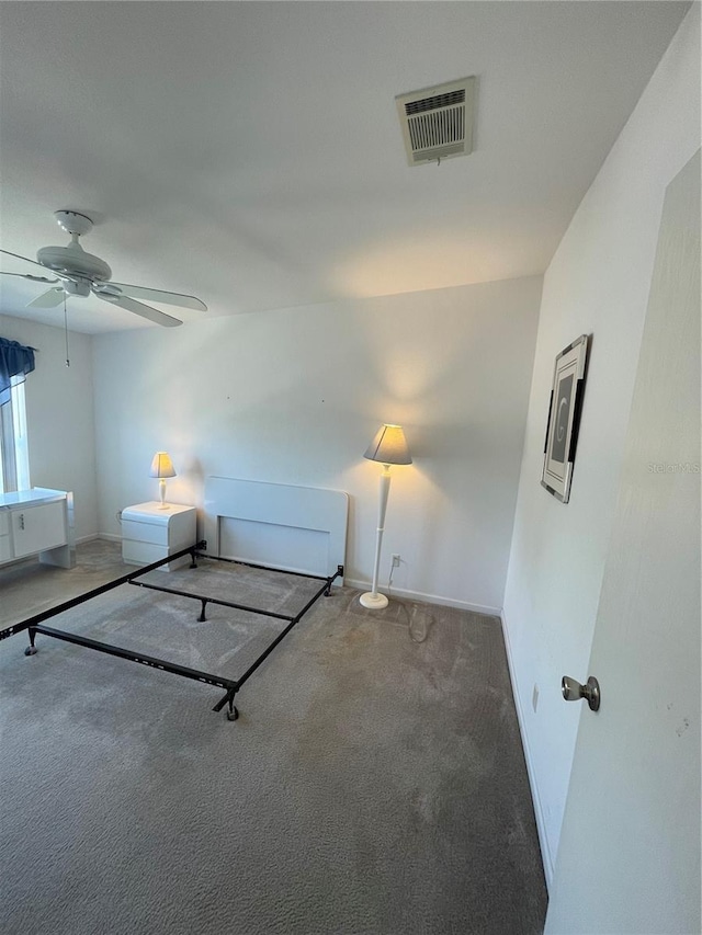 unfurnished bedroom featuring ceiling fan and carpet