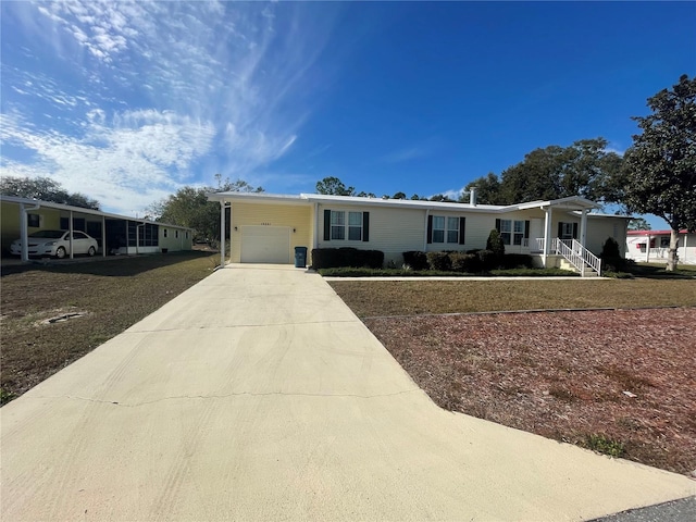 view of front of house with a porch, a front yard, and a carport