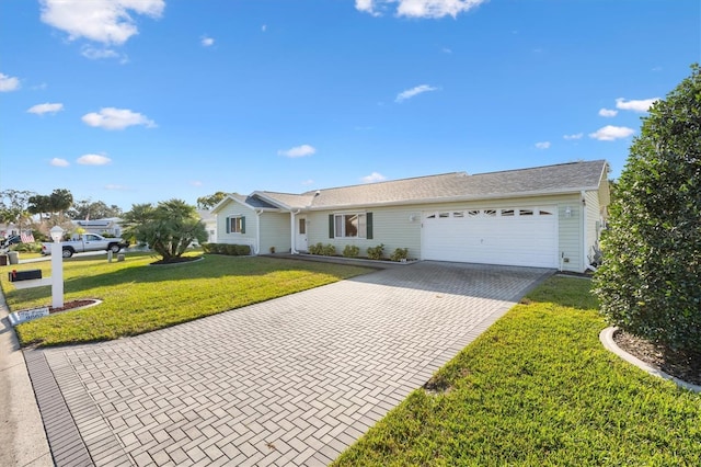 ranch-style house featuring a garage and a front lawn