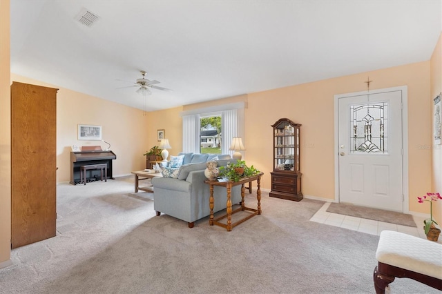 living room with light carpet and ceiling fan