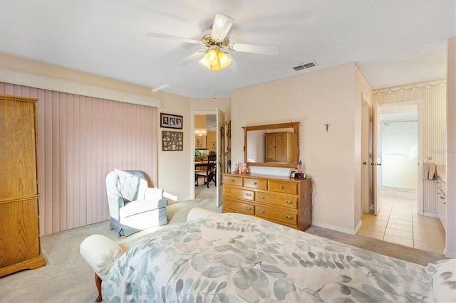 bedroom featuring ceiling fan and light carpet