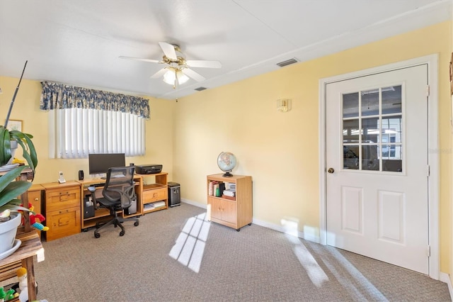 home office featuring carpet and ceiling fan