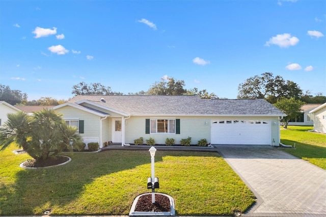 single story home featuring a front yard and a garage