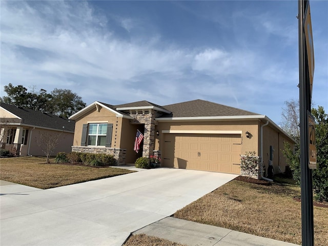 view of front of property with a garage and a front yard