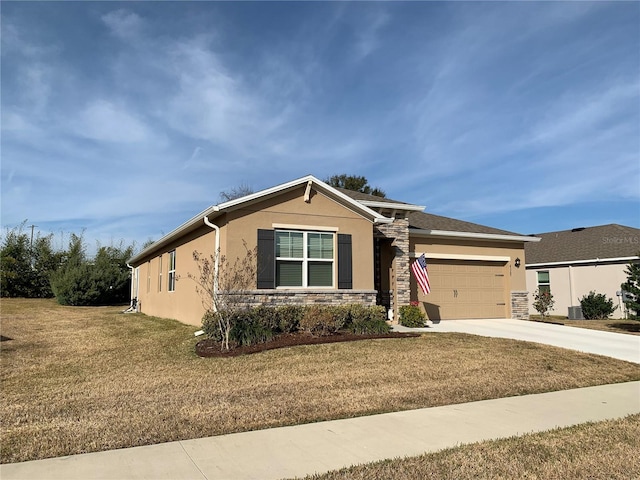 view of front of property with a garage and a front yard